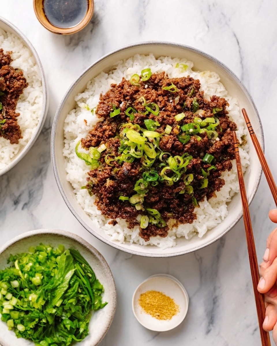 The image shows a white bowl filled with white rice at the bottom layer, topped with a thick layer of dark brown cooked meat mixed with small pieces of green onions scattered on top. Next to the bowl, there is a small white bowl filled with fresh green chopped leafy vegetables, and a small white dish with a yellow powder, likely seasoning. A woman's hand is holding wooden chopsticks above the bowl, ready to pick up the food. The bowls and dishes are placed on a white marbled surface. Photo taken with an iphone --ar 4:5 --v 7