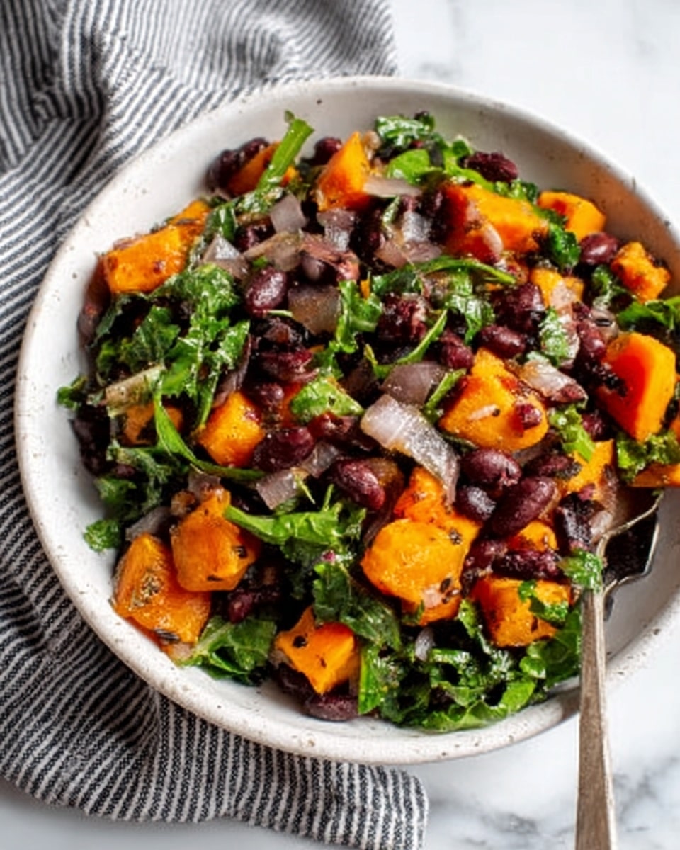 A white bowl filled with a colorful salad containing bright orange chunks, dark brown beans, and fresh green leafy vegetables, all mixed evenly with small bits of translucent onions. The bowl is placed on a white marbled surface, and a striped cloth is partially visible in the background. The textures vary from soft beans to crisp greens and tender orange pieces, creating a rich mix of shapes and colors. Photo taken with an iphone --ar 4:5 --v 7