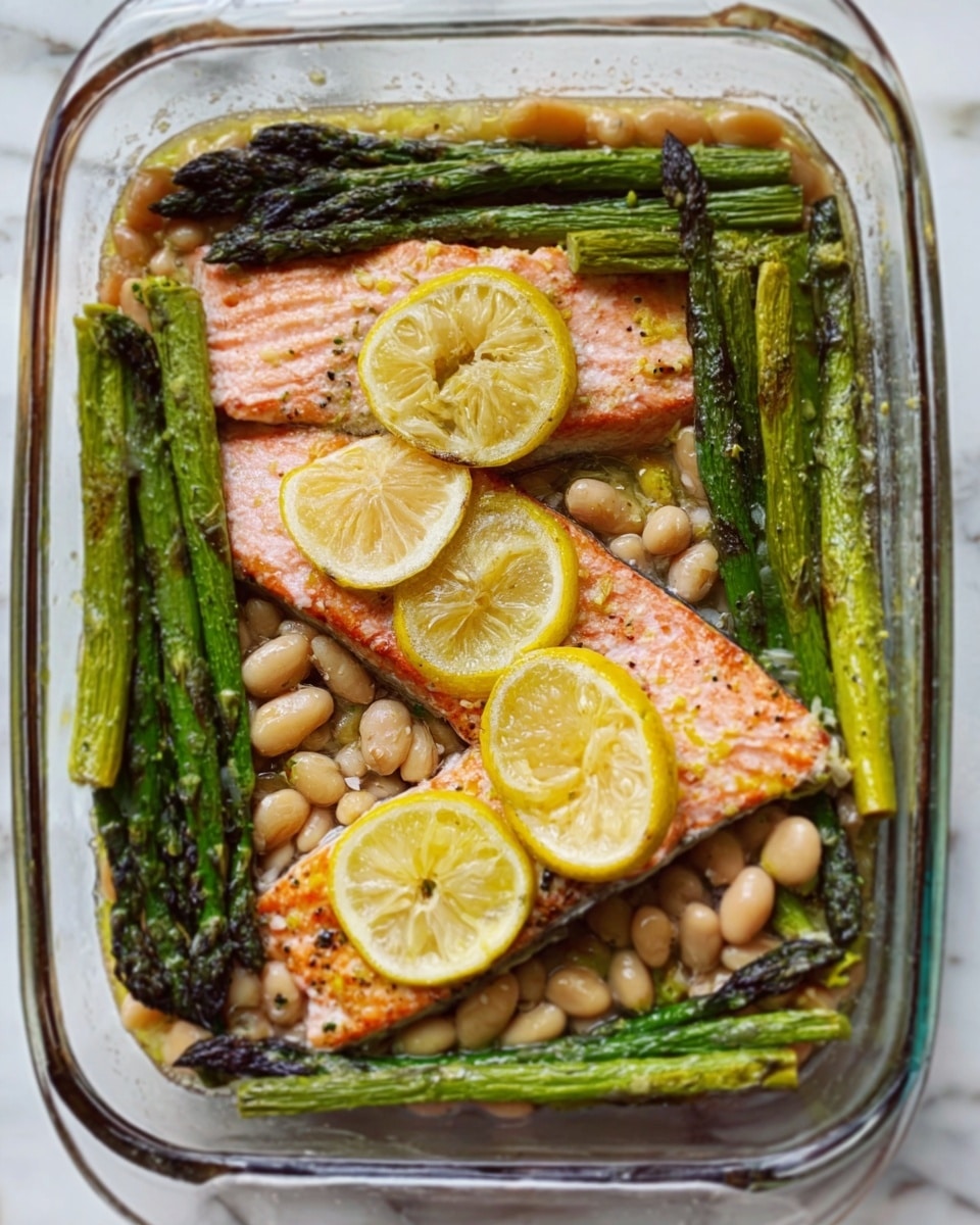 The image shows a clear glass baking dish filled with two cooked salmon fillets topped with bright yellow lemon slices. Around and under the salmon are pale beige beans and whole asparagus spears with a charred surface, adding dark green and black tones. The lemon slices on top add round shapes and bright highlights. The dish sits on a white marbled surface, creating a clean and fresh look. The texture contrasts include flaky salmon, soft beans, and slightly crispy asparagus. Photo taken with an iphone --ar 4:5 --v 7