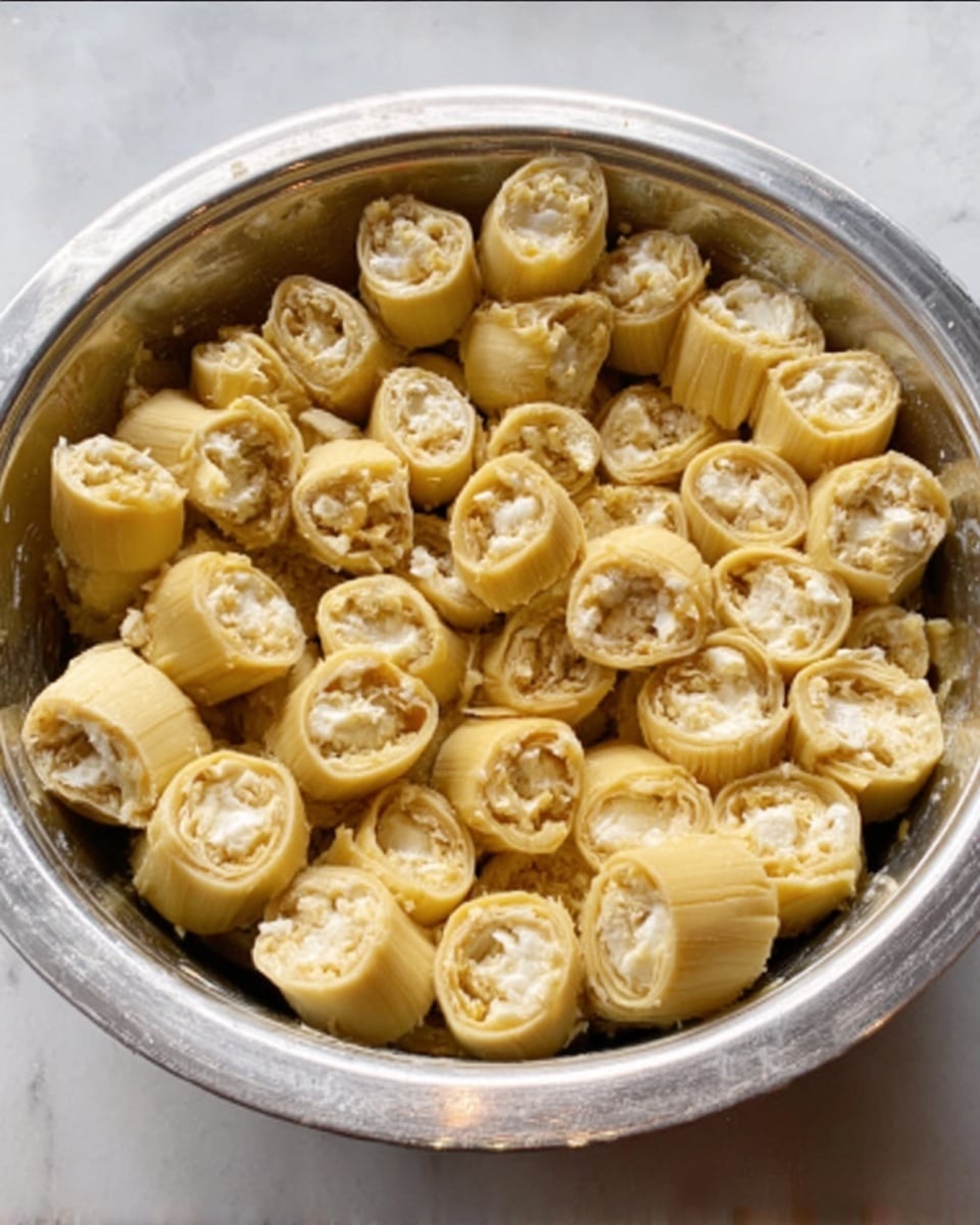The image shows a traditional food wrapped in light brown corn husks placed on a white plate on a white marbled surface. The main portion is partially unwrapped, revealing layers inside: the bottom layer is white and smooth, topped with a reddish-brown chunky layer, and sprinkled with white pieces on top. A silver fork is held by a woman's hand reaching towards the food. Surrounding images show the food in different stages: the unwrapped white base, the reddish-brown topping placed on it, several tightly wrapped bundles tied with strips, and one fully wrapped bundle lying flat. Photo taken with an iphone --ar 4:5 --v 7