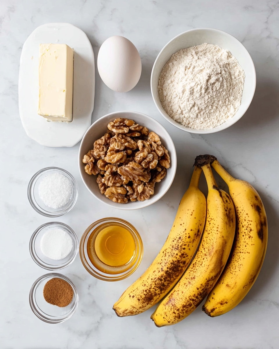 The image shows ingredients for baking neatly arranged on a white marbled surface. There are three ripe bananas with brown spots on the right side. Above the bananas is a small white block of butter and an egg placed to the left of it. To the top right of the egg is a white bowl filled with flour, while to its left is another white bowl filled with whole walnuts. Below the walnuts is a small glass bowl holding a golden liquid, likely honey or syrup. Near the bottom left are four small clear glass bowls, each holding a different powder: cinnamon, salt, baking powder, and baking soda from left to right, top row to bottom. On the far right above the bananas is a white bowl full of white granulated sugar. The whole setup is simple and clean with good lighting. Photo taken with an iphone --ar 4:5 --v 7