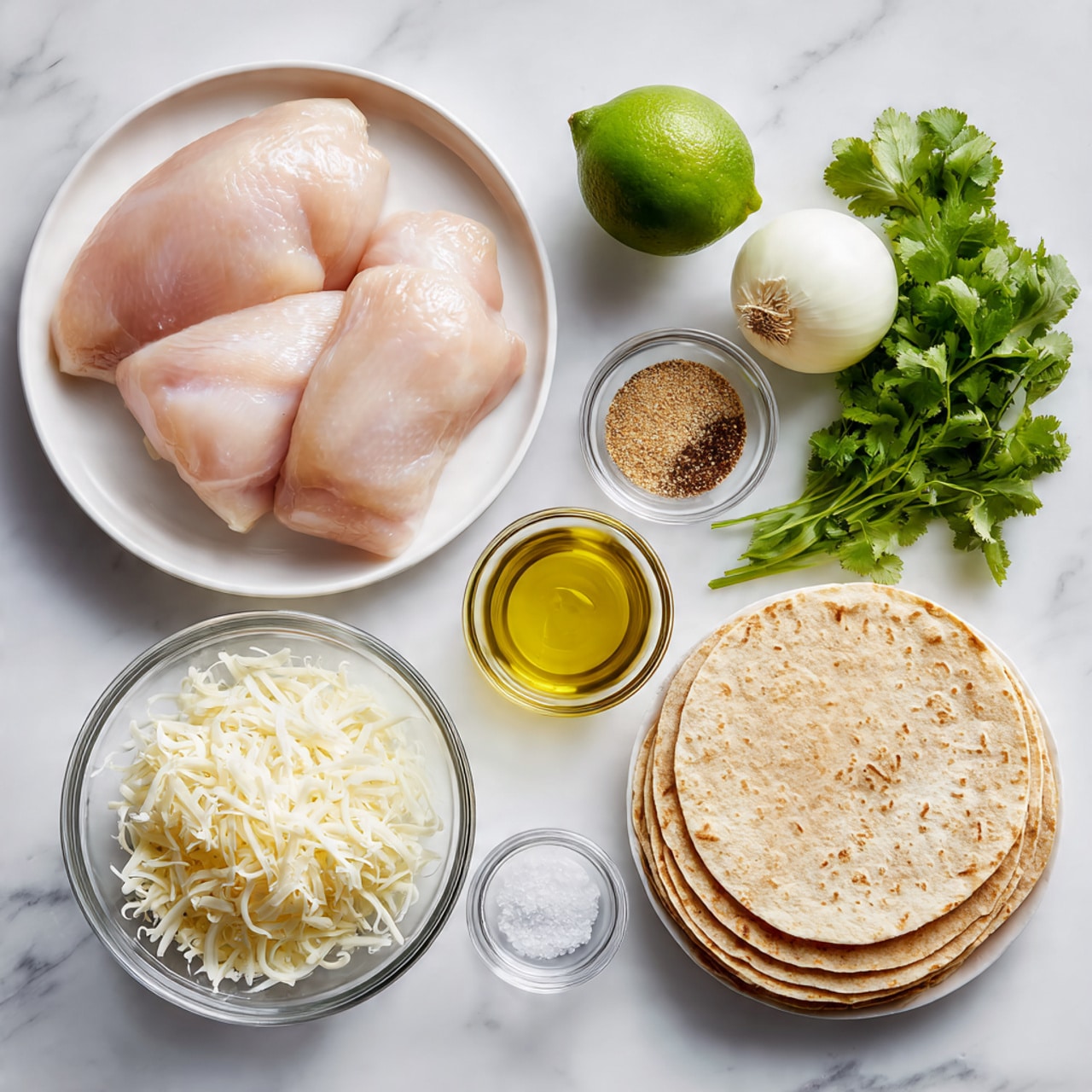 The image shows raw ingredients neatly arranged on a white marbled surface. On the left, three pieces of pale pink raw chicken are placed on a white plate. Above them is a whole green lime, and next to the lime, a whole white onion is positioned. To the right of the onion, a small clear bowl contains light brown spices, and next to it is a small bowl of yellow oil. Below the chicken, two small glass bowls hold salt and pepper. In the middle of the image, a clear bowl is filled with shredded white cheese. To the right of the cheese is a stack of round, light brown tortillas, and on the far right, a bunch of fresh green cilantro sits beside the tortillas. The scene is clean and organized, showing fresh and simple raw ingredients ready for cooking. photo taken with an iphone --ar 4:5 --v 7