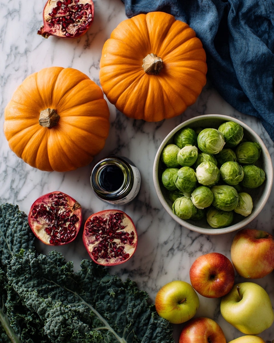 The image shows two large bright orange pumpkins on the top left, with a small black jar with a white label placed just below them. On the right side, a white bowl is filled with green Brussels sprouts. Surrounding the pumpkins and bowl are various fruits and vegetables, including dark green kale leaves at the bottom left, a split open pomegranate showing its red seeds in the center, and a mix of yellow and red apples nearby. There is a dark blue cloth partially visible near the bottom center, all set on a white marbled surface. Photo taken with an iphone --ar 4:5 --v 7