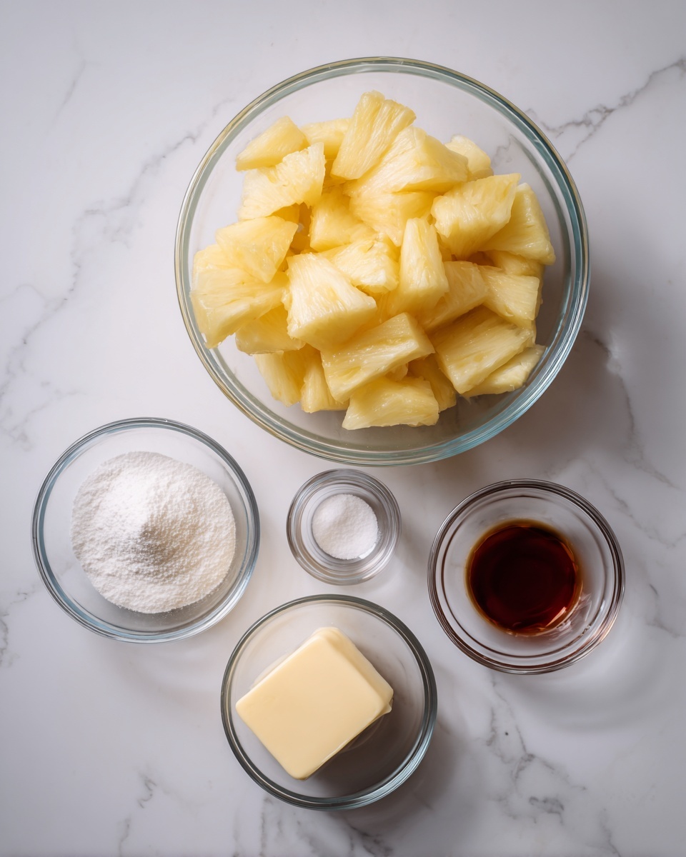 A clear glass bowl filled with uneven yellowish pineapple chunks sits near the top center. Below it are five smaller clear glass bowls placed in a loose semi-circle on a white marbled surface. From left to right, the bowls contain white baking powder, white granulated sugar, empty, dark amber vanilla extract, and a light yellow square of butter. The overall look is clean and simple with a bright natural light. Photo taken with an iphone --ar 4:5 --v 7