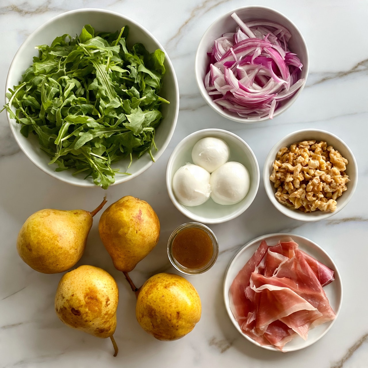 square image The image shows ingredients for a salad arranged on a white marbled surface. There is one large white bowl filled with fresh green arugula leaves, a small white bowl with thin purple-red slices of onion, another small white bowl holding two white balls of fresh mozzarella in water, and a third small white bowl filled with light brown walnut pieces. Three whole, golden-yellow pears with some brown spots are placed directly on the surface near a small glass jar of brown salad dressing. Lastly, there is a small white plate with several thin slices of pink prosciutto layered in a slightly overlapping way. Photo taken with an iphone --ar 4:5 --v 7