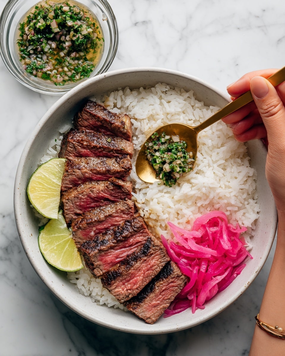 The image shows a white bowl filled with three main layers: at the bottom, there is a bed of fluffy white rice; in the middle, there are several slices of medium-rare grilled steak with a brown and slightly pink inside, neatly arranged in a row; on the right side, bright pink pickled onions are placed next to the steak. Above the steak, a brass spoon is held by a woman's hand, adding a topping of chopped green herbs mixed with garlic and onions. A wedge of lime is placed near the pickled onions. In the background, there is a glass bowl with extra herb mixture. The surface beneath the bowl is a white marbled texture. Photo taken with an iphone --ar 4:5 --v 7