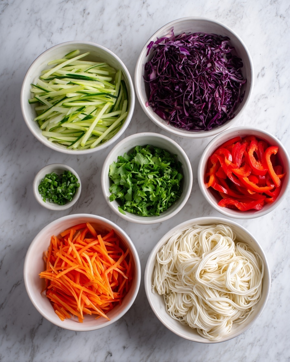 The image shows six white bowls arranged on a white marbled surface, each filled with different fresh ingredients. Starting from the top left, there are thin green cucumber sticks in the first bowl, next to it on the right is a bowl filled with dark purple shredded cabbage. On the far right is a bowl of bright red sliced bell peppers. Below them, on the left is a bowl of thin orange carrot sticks, in the center a small bowl of chopped fresh green cilantro, and finally a larger bowl of white cooked noodles with a soft texture. The bowls are neatly organized and the colors of the vegetables are bright and fresh, making a vibrant and clean presentation. photo taken with an iphone --ar 4:5 --v 7