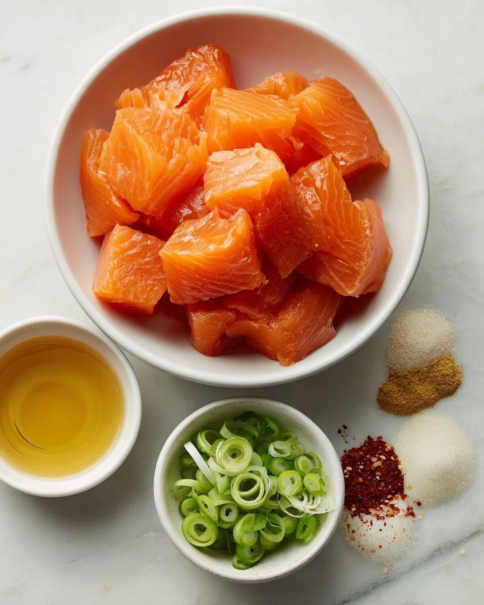 A white bowl is filled with bright orange cubes of raw salmon, showing smooth and slightly shiny texture. Next to it, a small white bowl holds sliced green onions, fresh and vibrant with light and dark green rings. Below these, there are two small white bowls; one contains a golden honey-like liquid that is smooth and shiny, the other bowl has four small piles of powdered spices in shades of beige, white, and red, arranged separately and creating a nice contrast. All the bowls are placed on a white marbled surface, clean and bright. Photo taken with an iphone --ar 4:5 --v 7