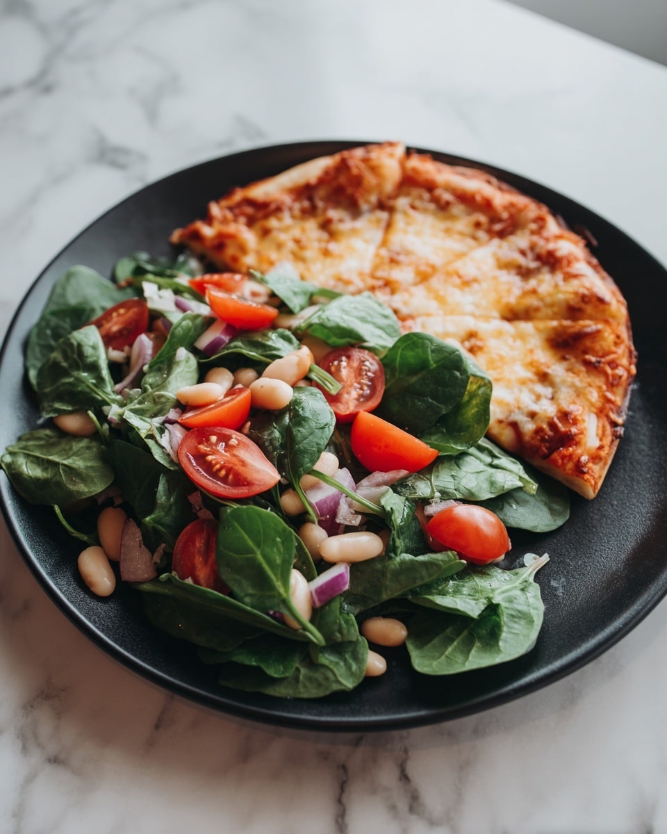 A black plate holds a fresh salad and one slice of pizza. The salad consists of three layers: the first layer is made of bright red cherry tomatoes and white beans that look soft and smooth; the second layer is made of green leafy spinach pieces scattered all over; the third layer shows small bits of purple onion mixed within. Behind the salad, a single slice of thin-crust pizza stands upright, showing its golden, slightly bubbly cheese topping and a light, crispy edge. The plate sits on a white marbled surface. photo taken with an iphone --ar 4:5 --v 7
