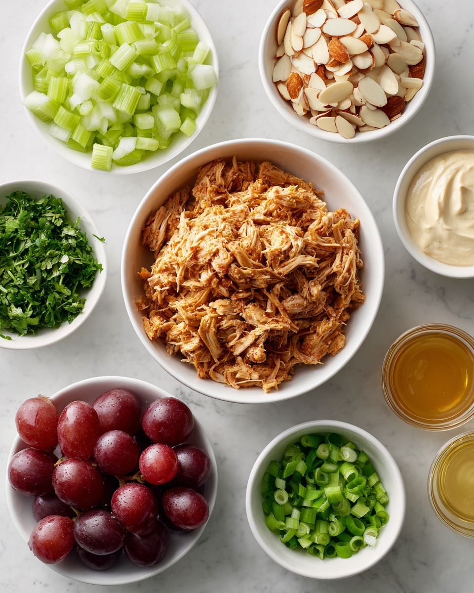 There are seven white bowls on a white marbled table. The middle bowl has shredded cooked meat, brown in color with soft texture. Around it, the top left bowl holds chopped celery, light green in color. The top middle bowl contains sliced almonds, beige with a smooth texture. The top right bowl has chopped fresh herbs, dark green and leafy. At the bottom left, a bowl shows halved red grapes with deep purple skin and juicy inside. The bottom right bowl has chopped green onions with a fresh green color. Near the right side, three small glass containers hold creamy white mayo, light brown mustard, and golden honey. The scene is clean and bright. Photo taken with an iphone --ar 4:5 --v 7