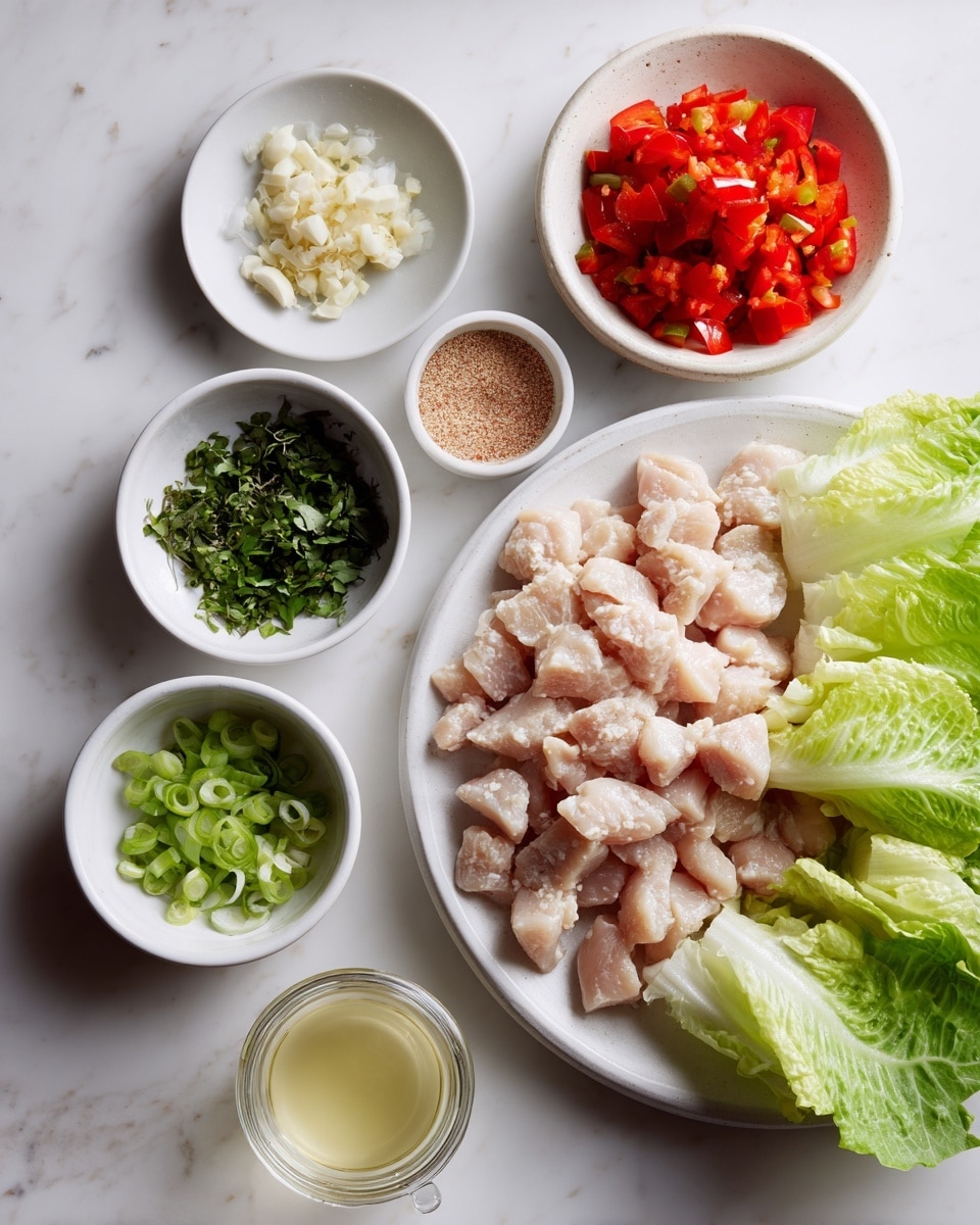 A white round plate on the right side is filled with finely chopped light pink chicken pieces. Around this plate, there are six small white bowls and a glass jar arranged on a white marbled surface. Starting at the top left, a small bowl holds tiny off-white chopped garlic. Below it, a bowl has chopped green herbs, next to that, a bowl with light green sliced spring onions. Above the spring onions, a white measuring cup contains bright red chopped bell peppers. Below these bowls, there is a small white bowl filled with a pale yellow liquid, likely vinegar or lemon juice. At the bottom center, a glass jar contains a brownish powder or seasoning. To the right side of all the bowls, several light green and white lettuce leaves are spread, showing fresh and crisp textures. Photo taken with an iphone --ar 4:5 --v 7