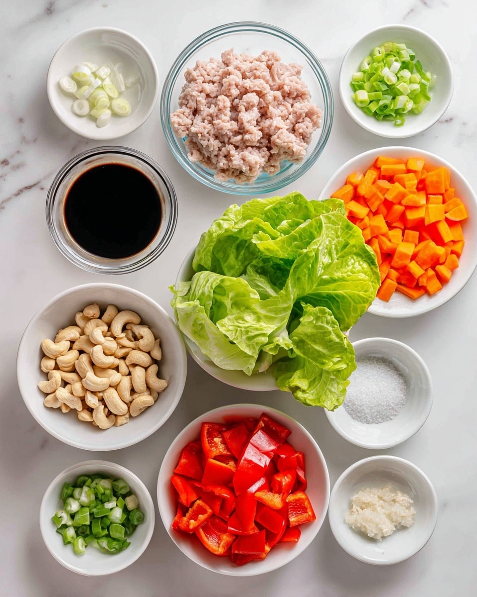 The image shows many small white bowls placed on a white marbled surface, each containing different ingredients. In the center bottom, there is a white bowl filled with fresh green lettuce leaves. To the right of the lettuce bowl, there is a smaller white bowl filled with diced bright orange carrots and above it, a white bowl with chopped red bell peppers. Below the chopped peppers are round white bowls containing cashew nuts and dark soy sauce. Above the soy sauce is a clear glass bowl holding pale pink ground meat. Several small white bowls surrounding these main bowls hold ingredients like minced garlic, white powder, fresh ginger paste, and sliced green scallions. The colors contrast nicely with the clean white background, and the arrangement looks neat and fresh. Photo taken with an iphone --ar 4:5 --v 7