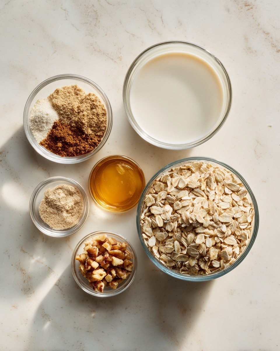 The image shows a top view of six small clear bowls placed on a white marbled surface. The largest bowl on the right is filled with rolled oats, light beige with a rough texture. Below it, a smaller bowl contains golden honey with a smooth, shiny surface. Above the oats to the right, a medium bowl is filled with white milk, smooth and creamy. On the upper left, a small bowl holds a mix of brown cinnamon powder and light beige ground ginger powder with a soft texture. Below this, another small bowl contains chopped light brown nuts scattered unevenly. The overall arrangement is neat and the bowls cast soft shadows, showing a fresh, natural feel. Photo taken with an iphone --ar 4:5 --v 7