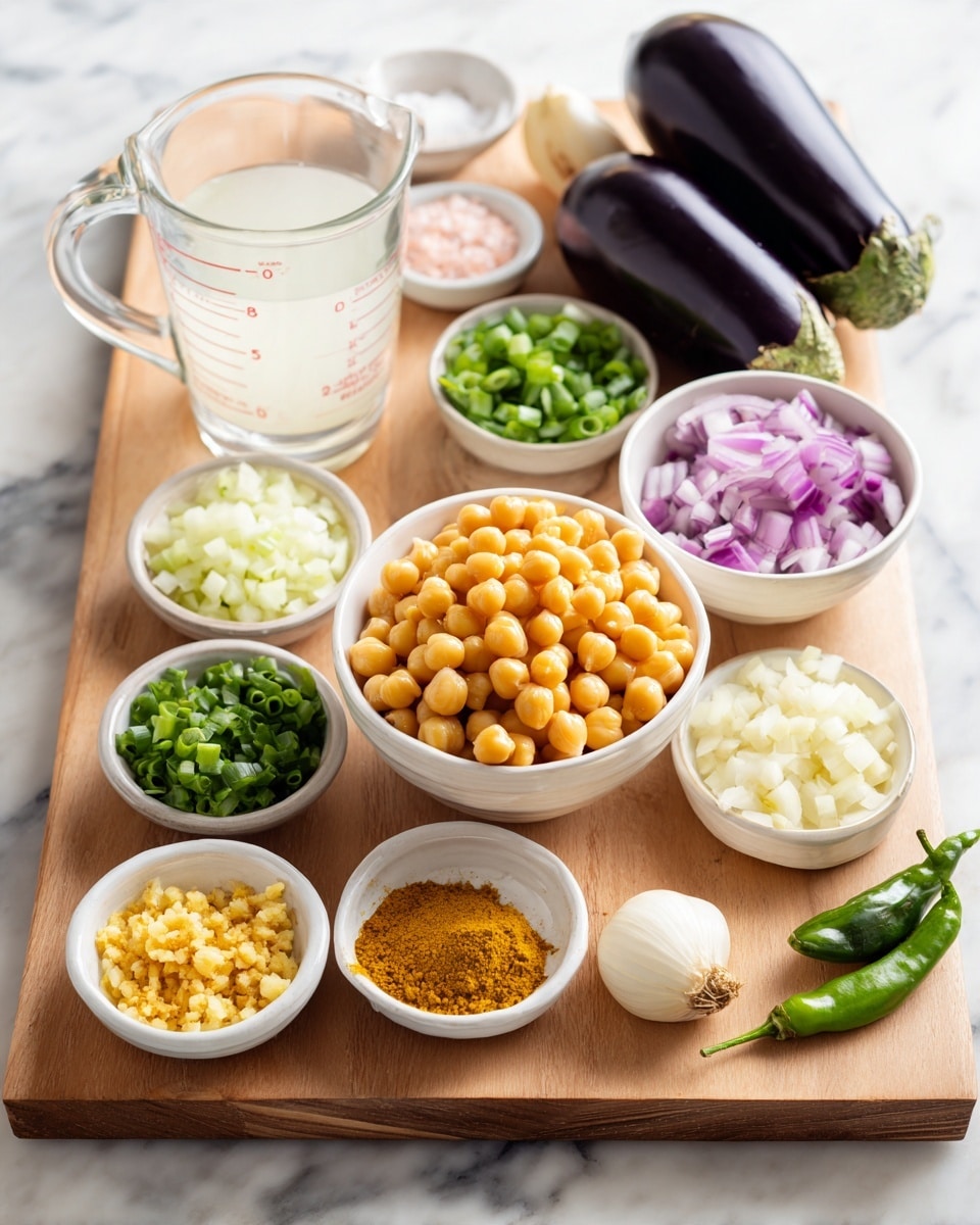 A wooden board with several small white bowls and a glass measuring cup are arranged on a white marbled surface. In the center is a white bowl full of yellow chickpeas, above it to the right is a large dark purple eggplant. To the left of the chickpeas is a glass measuring cup filled with white liquid, with a small white bowl of pink salt behind it. Below the measuring cup is a small white bowl of yellow curry powder, further down is another white bowl holding minced yellow ginger. Surrounding these are bowls with chopped green onions, white chopped onions, sliced white garlic, and small yellow chunks, along with a few green herbs and a small green chili on the board. Photo taken with an iphone --ar 4:5 --v 7
