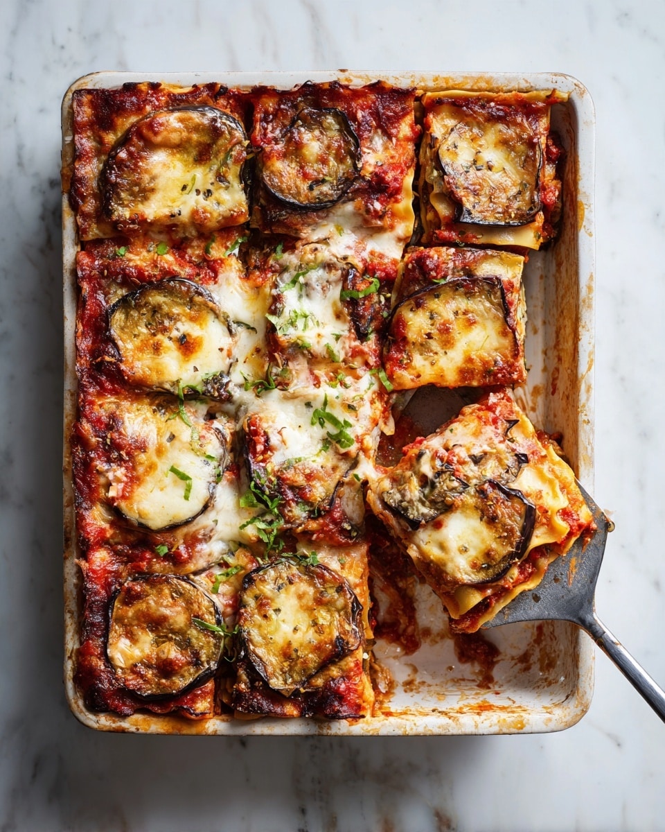 A rectangular white baking tray with baked lasagna cut into square pieces is shown on a white marbled surface. The lasagna has multiple visible layers: the bottom layer is made of soft pasta sheets, followed by a red tomato sauce layer, then slices of browned and slightly crispy eggplant, topped with melted, golden-brown cheese. A woman's hand holds a metal spatula beneath one lifted piece of lasagna, showing the soft, layered inside. The tray shows baked-on sauce stains around the edges. Photo taken with an iphone --ar 4:5 --v 7