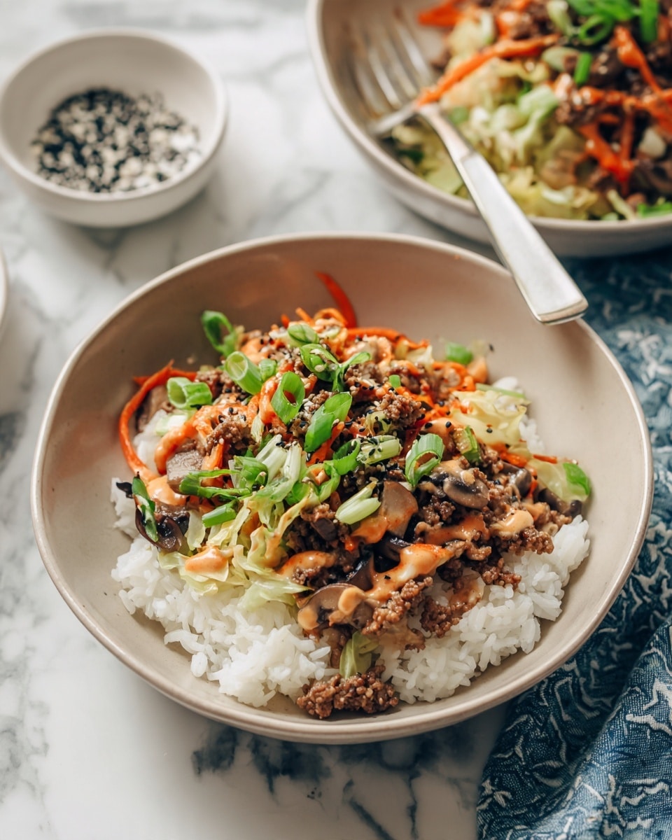 A beige bowl filled with a layered dish starts with a base of white rice. On top, there is a colorful mix made of cooked ground meat, thin strips of orange carrots, light green cabbage, and small pieces of dark brown mushrooms. The mix is garnished with chopped green onions and fresh green herbs. A sauce with a reddish hue is drizzled over the top. A fork with a white handle rests on the edge of the bowl, which sits on a white marbled surface next to a white dish with black sesame seeds and a blue and white cloth napkin. In the background, another bowl with the same dish is slightly out of focus. photo taken with an iphone --ar 4:5 --v 7