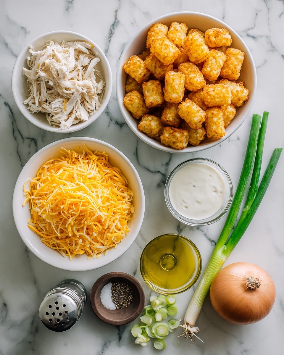 The image shows a top view of different ingredients arranged on a white marbled surface. On the top right, there is a white bowl filled with golden crispy tater tots. To the left of it is another white bowl with shredded cooked chicken, pale in color with thin soft strands. Below this, a white bowl contains a bright yellow heap of shredded cheddar cheese. To the right of the cheese bowl, there is a small transparent glass cup with white cream. Next to it on the right edge is a measuring cup filled with creamy light yellow soup with green specks. Near the bottom center, a whole onion sits on the surface next to a small dark brown bowl with salt and a small glass bowl of olive oil. Green onions and garlic cloves lie horizontally near the left edge. A silver pepper shaker is placed below the cheese bowl. All the bowls and cups are white except for the transparent ones, and all items are neatly spread out on the white marbled background. Photo taken with an iphone --ar 4:5 --v 7