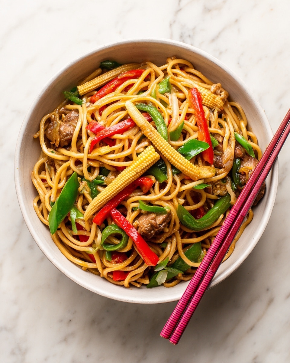 A bowl filled with stir-fried noodles mixed with baby corn, red chili slices, green bell peppers, and pieces of cooked meat; the noodles are light brown with a slight shine, the baby corn is pale yellow, and the vegetables are bright and fresh. The bowl is white, placed on a white marbled surface. Two pink chopsticks rest on the right side of the bowl, slightly leaning over the edge. Photo taken with an iphone --ar 4:5 --v 7