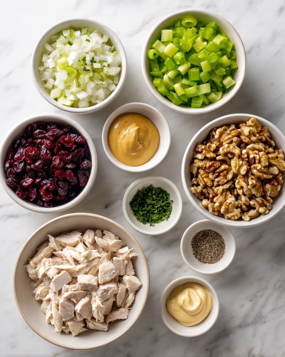 The image shows eight white bowls arranged on a white marbled surface. The largest bowl in the bottom left is filled with light-colored diced cooked chicken. Above it, a bowl with small, bright green diced celery. To the right of celery is a bowl with finely chopped white onions. Next to the onions, there's a bowl filled with chopped walnuts, displaying a golden-brown color. Above the walnuts, a small bowl holds a smooth, light orange mustard. Next to the mustard, a small bowl contains creamy, pale orange mayonnaise. Above the mayonnaise, a small bowl contains finely chopped green herbs, likely parsley. To the left of the herbs, a bowl holds dark red dried cranberries. Finally, a small bowl with dark brown ground pepper is placed next to the herbs. Everything is neatly organized and bright with clean colors. Photo taken with an iphone --ar 4:5 --v 7