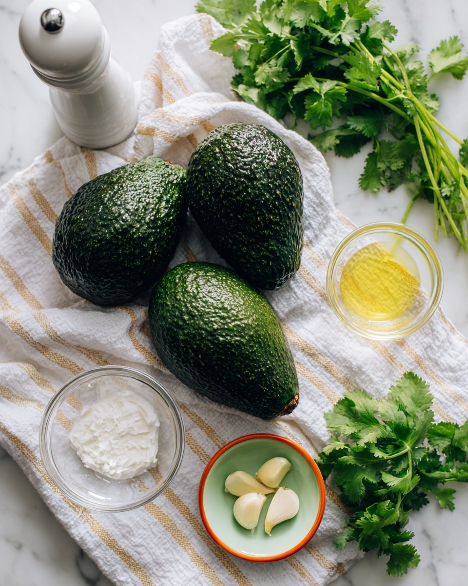 The image shows two dark green avocados with rough skin placed on a white cloth with gold stripes, inside a white marbled surface. Around the avocados, there are five small clear glass bowls and one small light green bowl with an orange rim. The bowls contain two peeled garlic cloves, white salt, light yellow liquid (likely lemon juice), a creamy white substance (likely sour cream or yogurt), and fresh green cilantro leaves. There is also a tall white pepper grinder on the top left side. The scene is bright and clean with a soft shadow from natural light, creating a fresh and simple arrangement. Photo taken with an iphone --ar 4:5 --v 7