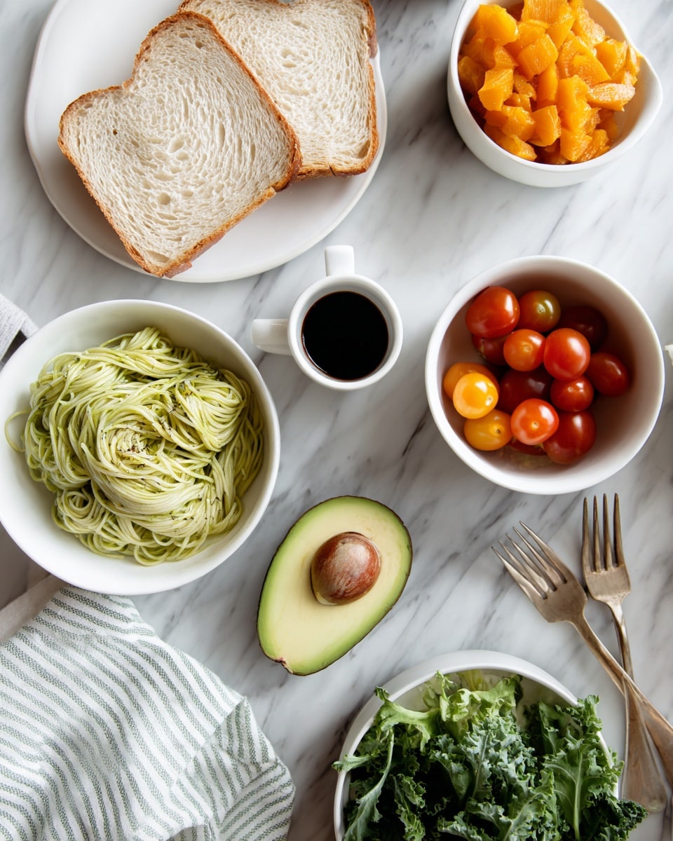 The image shows an overhead view of a food scene on a white marbled surface. In the center, there are two slices of bread on a white round plate, with a small cup of dark sauce nearby. Below the bread, there is a white bowl filled with light green noodles that have a soft texture, and next to it is a white bowl containing a sliced avocado. An avocado cut in half with its seed removed lies between the bowls, with an antique gold fork nearby. On the lower right side, there is a white bowl full of cherry tomatoes, and next to it is another white bowl with cooked orange pieces of food. Fresh green leafy vegetables rest on the lower left corner. At the bottom, a light green striped cloth napkin is partially visible. Photo taken with an iphone --ar 4:5 --v 7