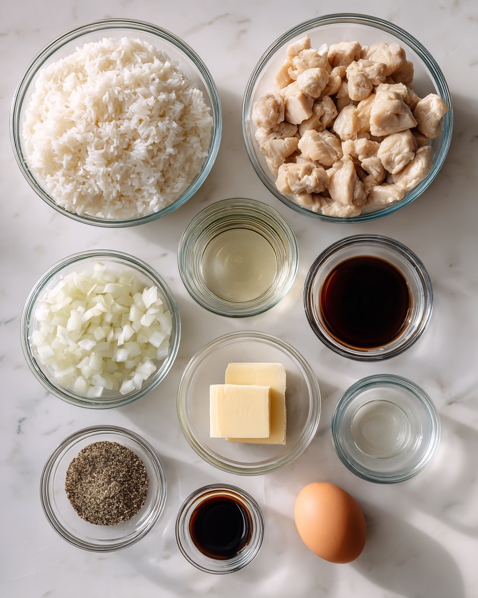 The image shows nine clear glass bowls arranged on a white marbled surface, each containing different ingredients. The top left bowl is large and filled with cooked white rice, fluffy and separate. Below it, another bowl holds chopped cooked chicken pieces, light beige in color. To the right of the rice bowl, there is a small bowl with clear liquid, likely vinegar or oil, next to it is another small bowl with a dark speckled seasoning. Below the bowls with liquids, a medium bowl is filled with chopped white onions with a slightly translucent look. Next to it, a small bowl holds a pale yellow square of butter. Below the onions and butter, a small bowl contains a dark soy sauce that is smooth and shiny. At the bottom center, there is a single brown egg in a small bowl. The bowls are spread neatly in rows, showing a clear and simple layout. Photo taken with an iphone --ar 4:5 --v 7